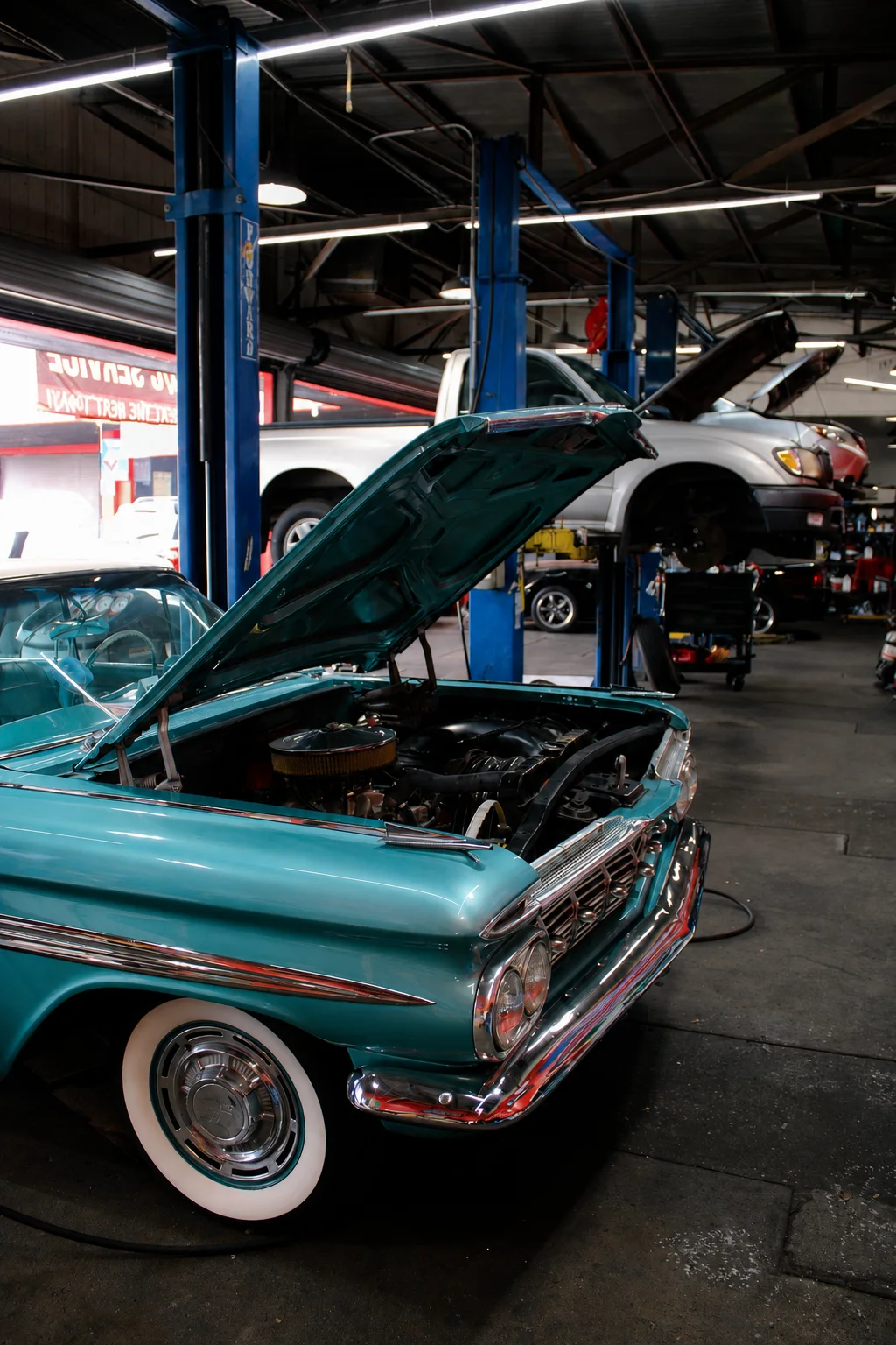 Classic Impala with its hood open