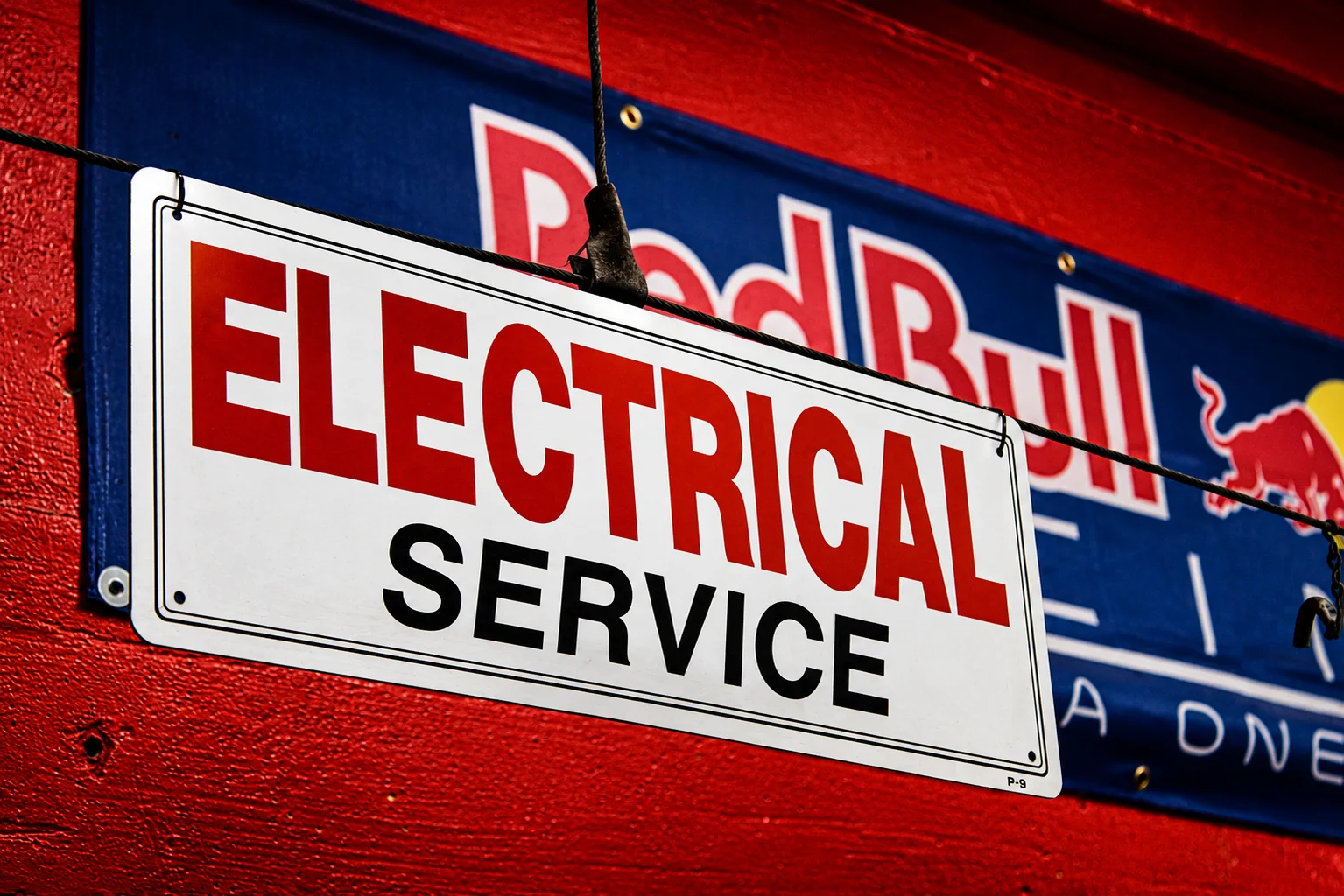 Electrical service sign inside Alex Jr’s auto repair shop